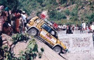 Crowd watches as Bob makes his way down into the riverbed