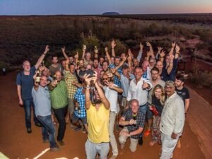 Farewell party on a sand dune overlooking the amazing Ayers Rock