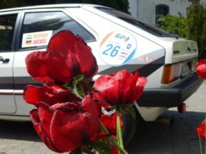 Fragrance of flowers and a lovely classic car- what a charming combination