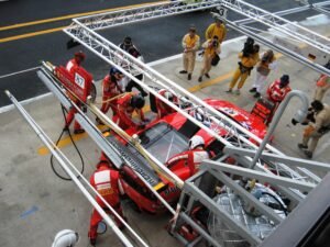 The Ferrari Team is known for its well orchestrated pit stops. Note the insulated fuel reservoir